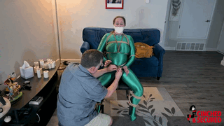 www.cinchedandsecured.com - 1480 - Minx Grrl - Super heroine tied, head fully taped and vibed! thumbnail