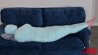 www.cinchedandsecured.com - 1516 - Minx Grrl's Blue Mummy Part 2 - Foot Tickling and Foot Worship thumbnail